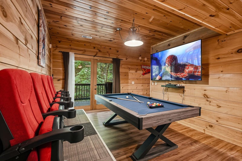 Your private game room awaits with a sleek billiard table, plush theater seating, and a largescreen TV—perfect for movie nights and friendly competition.