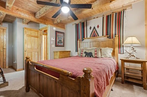 Drift off in your cozy retreat under warm wooden beams and a gentle ceiling fan. Rich, rustic furnishings and handwoven textiles create a welcoming mountain getaway.