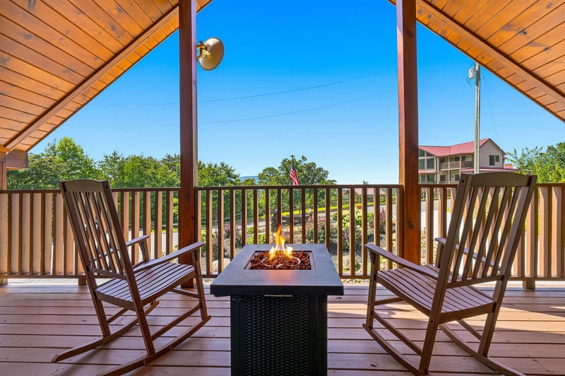 Rock gently in your chair by the fire pit while soaking in mountain views and crisp, fresh air from this covered terrace—your perfect retreat for morning coffee or evening stargazing.