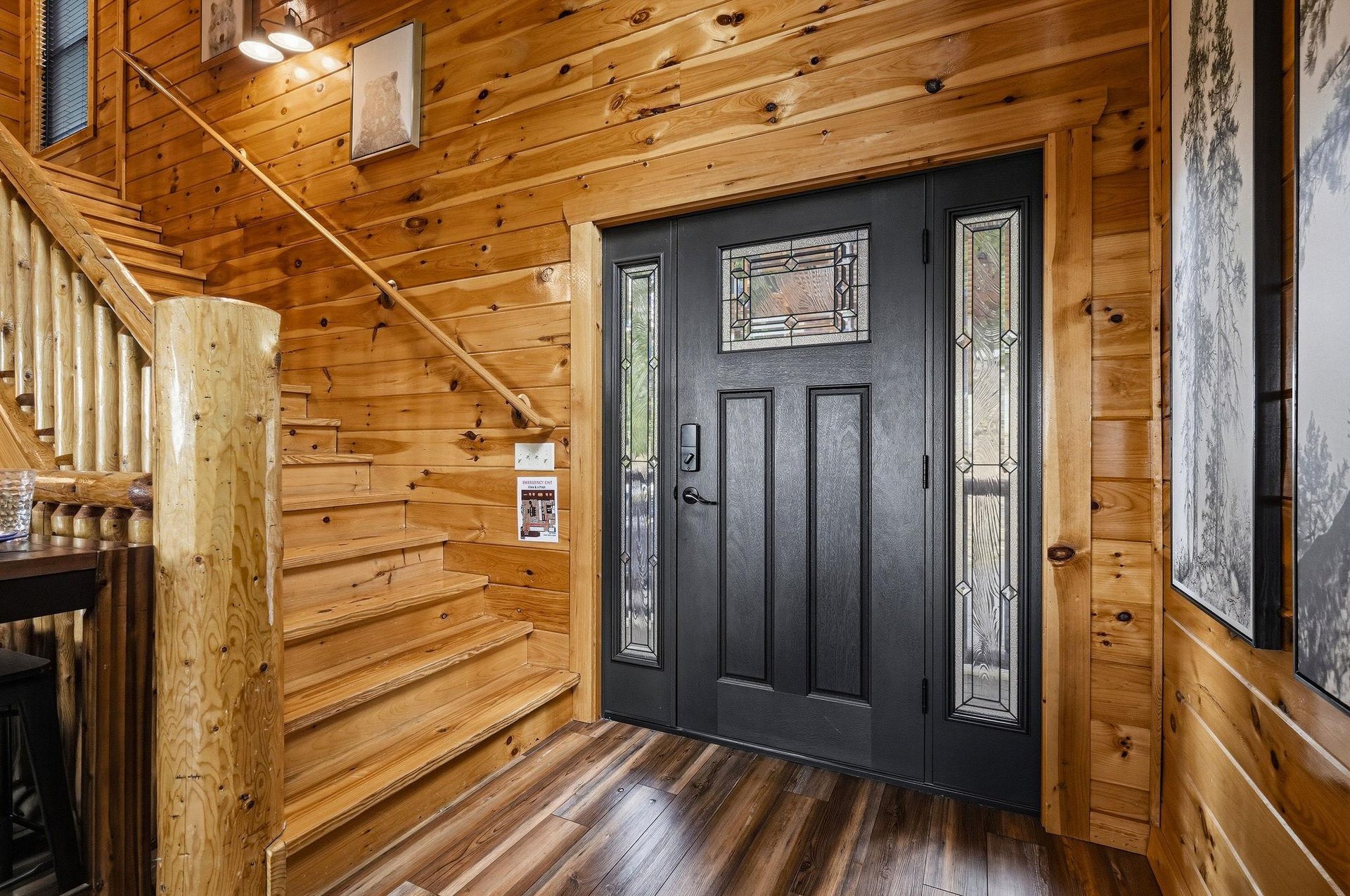 The propertys entrance welcomes guests with elegant decorative glass panels and warm natural wood throughout, setting the tone for your mountain getaway.