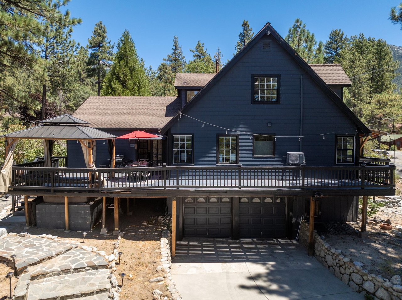 View of the wraparound deck and driveway.