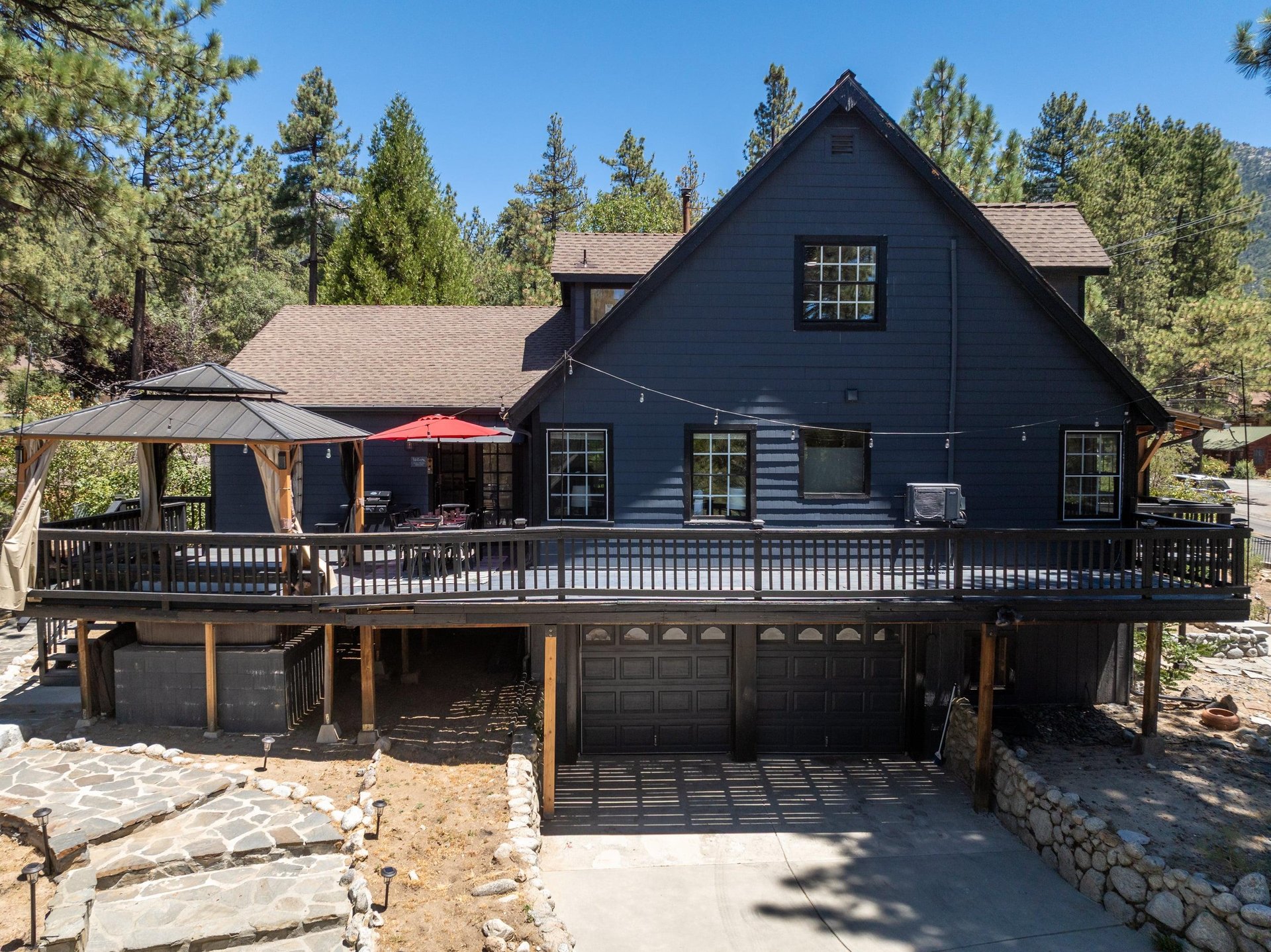 View of the wraparound deck and driveway.
