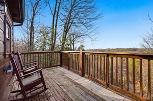 Settle into your rocking chairs on this peaceful deck, where mountain vistas and rolling hills create the perfect backdrop for morning coffee or evening relaxation.