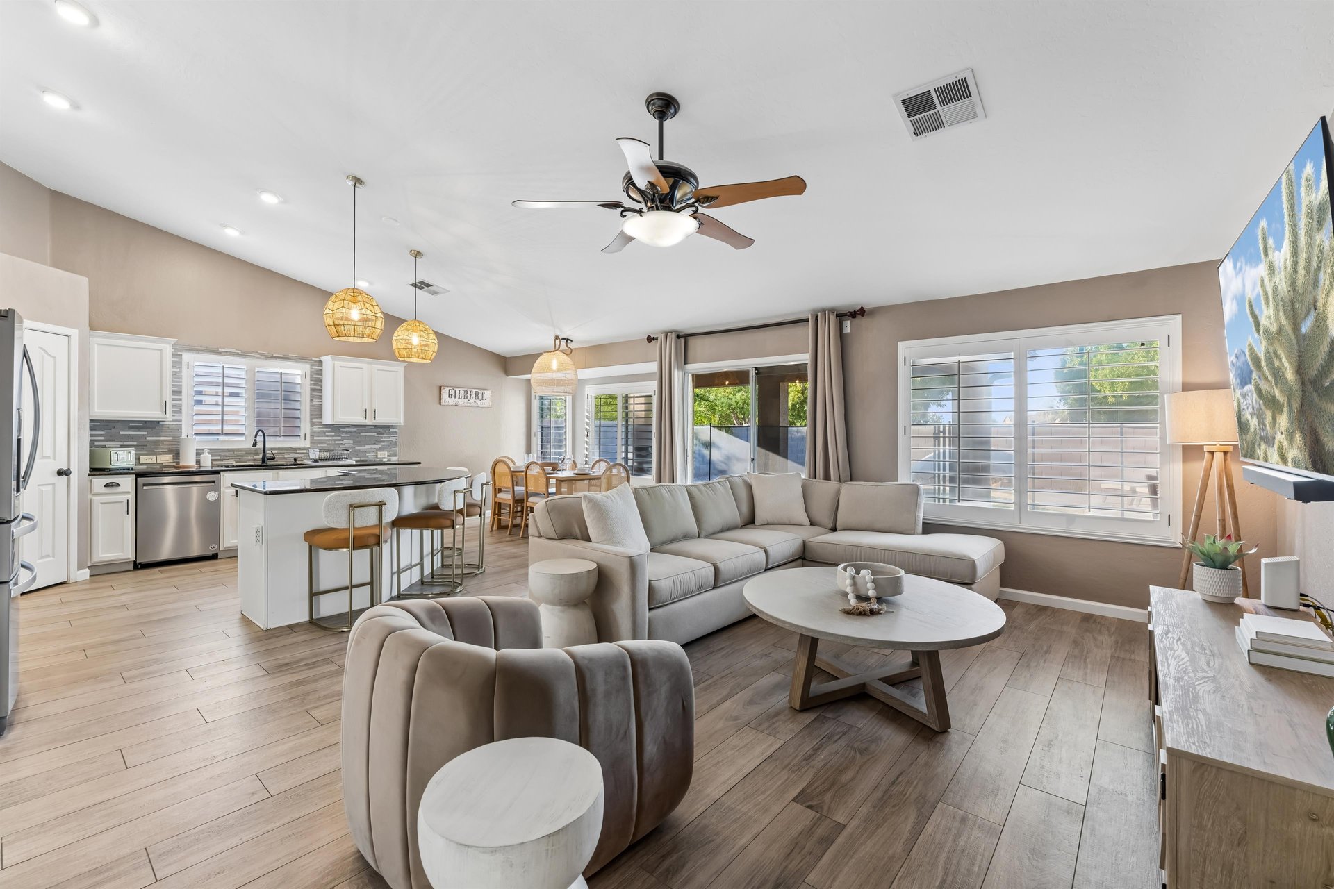 Ample seating, flatscreen TV, openconcept living space.
