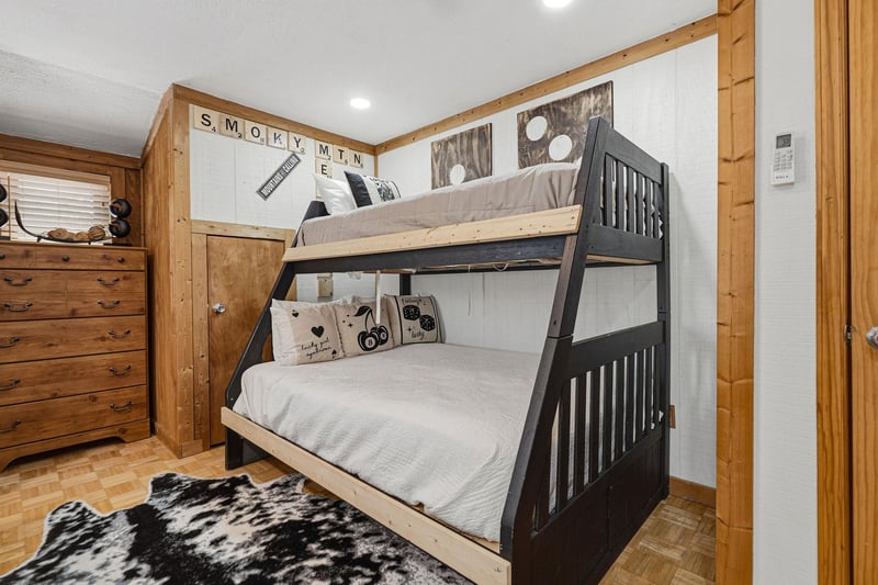Your cozy bunk room with rustic charm and playful Smoky Mountain touches creates the perfect sleep sanctuary.