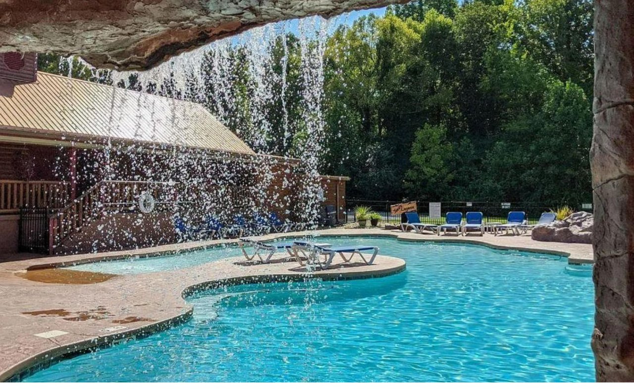 Dive into your private oasis with crystalclear waters and splash fountains creating a refreshing retreat under natural shade.