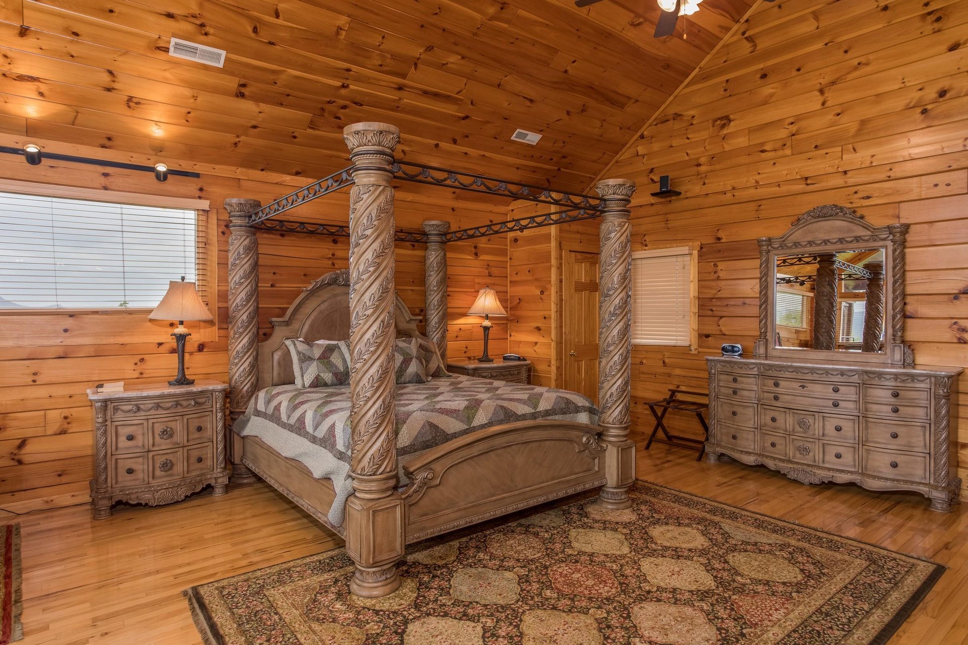 Kingsized canopy bed in the loft space at Howlin in the Smokies, a 2 bedroom cabin rental located in Pigeon Forge