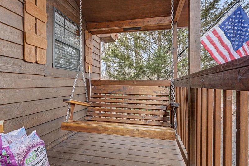 Unwind on this charming porch swing where you can sip your morning coffee while enjoying peaceful tree views.