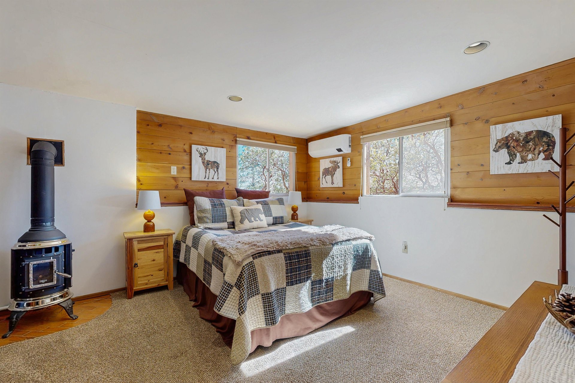 Downstairs bedroom with queen bed, remote controlled minisplit, and private entrance.