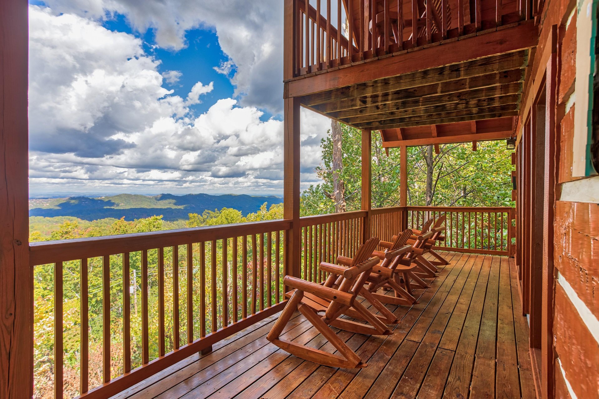 Rocking chairs on the lower deck at EllaVation, a 3 bedroom cabin rental located in Gatlinburg