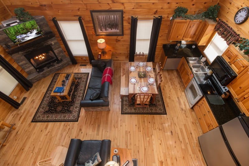 Looking down at the living room, dining space, and kitchen at Country Bears Getaway, a 3bedroom cabin rental located in Gatlinburg