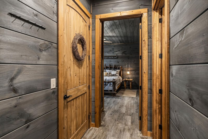 Step through rustic barn doors into your private retreat, where weathered wood and warm textures create a peaceful sanctuary designed just for you.