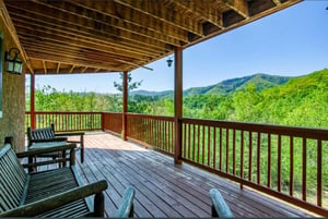Sip your morning coffee on this spacious covered deck while taking in sweeping mountain views that stretch as far as the eye can see.