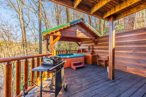 Hot tub on covered deck at Hidden Pleasure