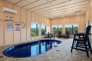 Dive into your own private oasis—a sparkling indoor pool framed by peaceful woodland views. The perfect retreat any time of day.
