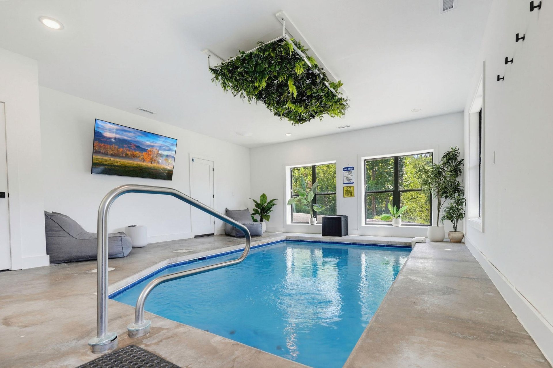 Imagine unwinding in your own private indoor pool, surrounded by greenery and natural light streaming through bright windows—a serene escape after a day of adventure.