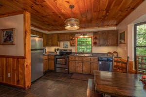Kitchen with stainless steel appliances at Hidden Pleasure, a 1bedroom cabin rental located in Gatlinburg