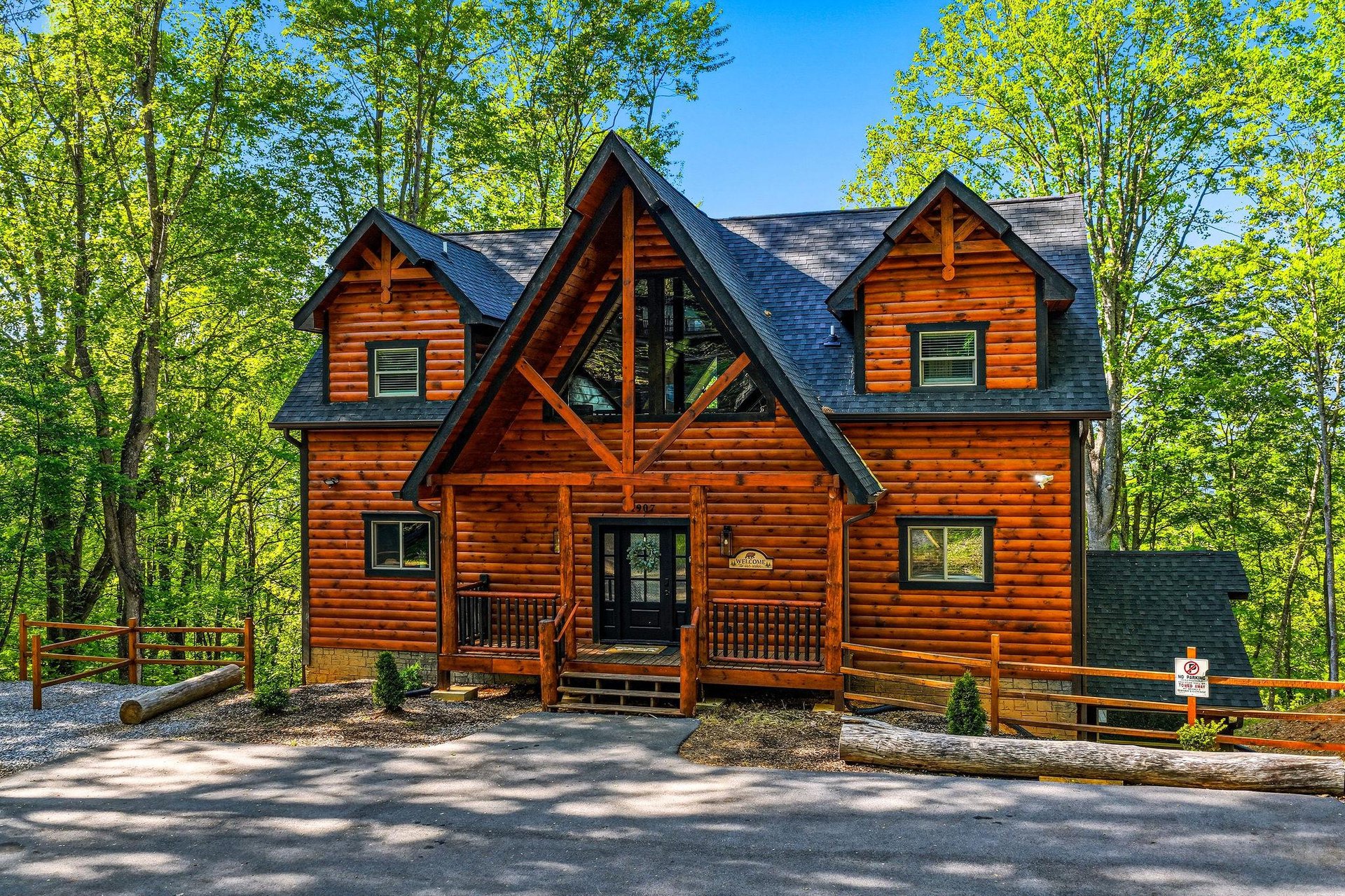 Beautiful log cabin surrounded by lush forest, featuring rustic wood architecture and peaceful mountain retreat atmosphere.