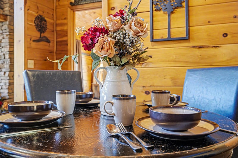 Gather around your beautifully set dining table, where rustic charm meets elegant touches for memorable meals together.