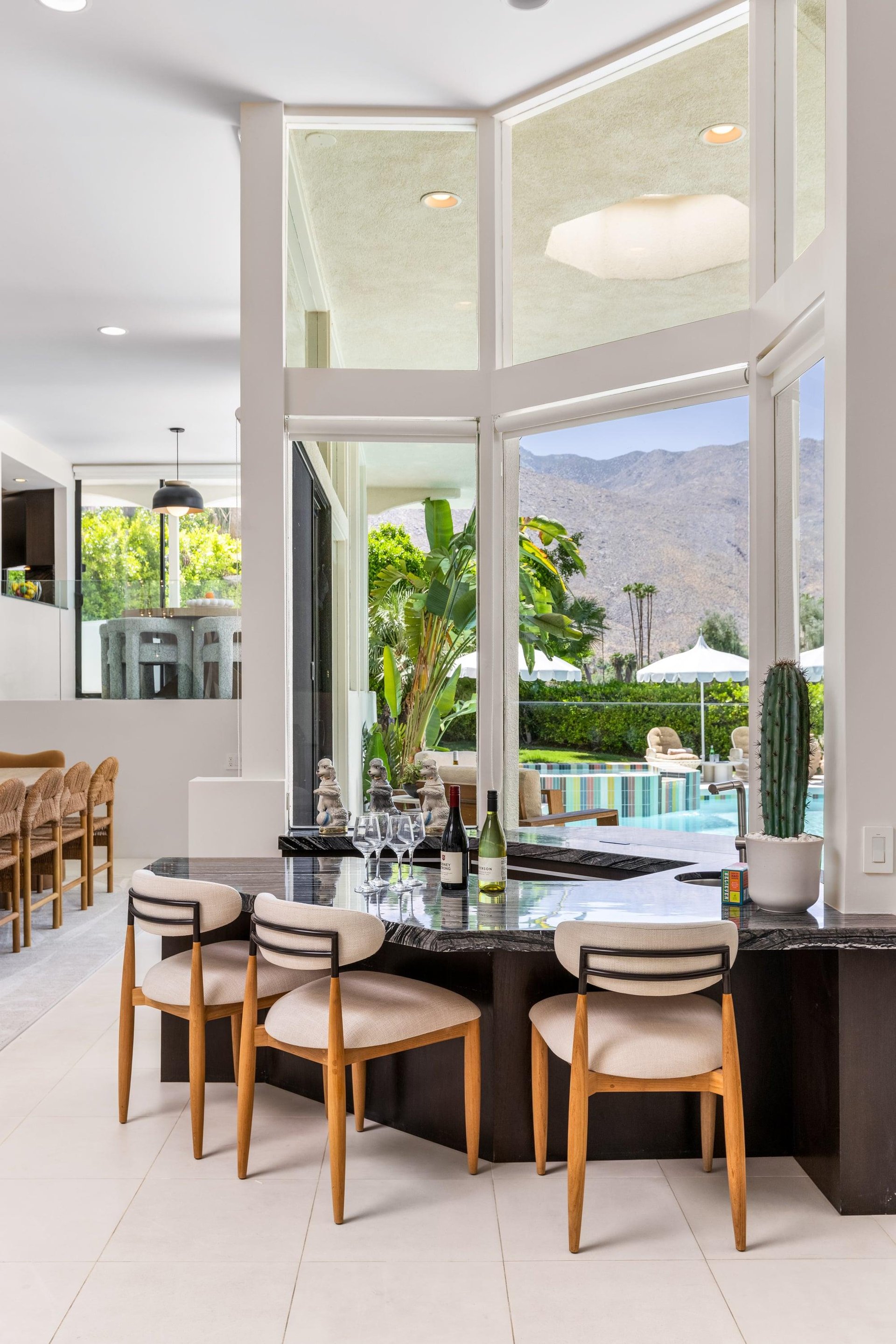 A bar space overlooking the patio and pool area can also be found in the sitting area.