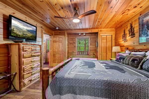 king bed, dresser, TV and view