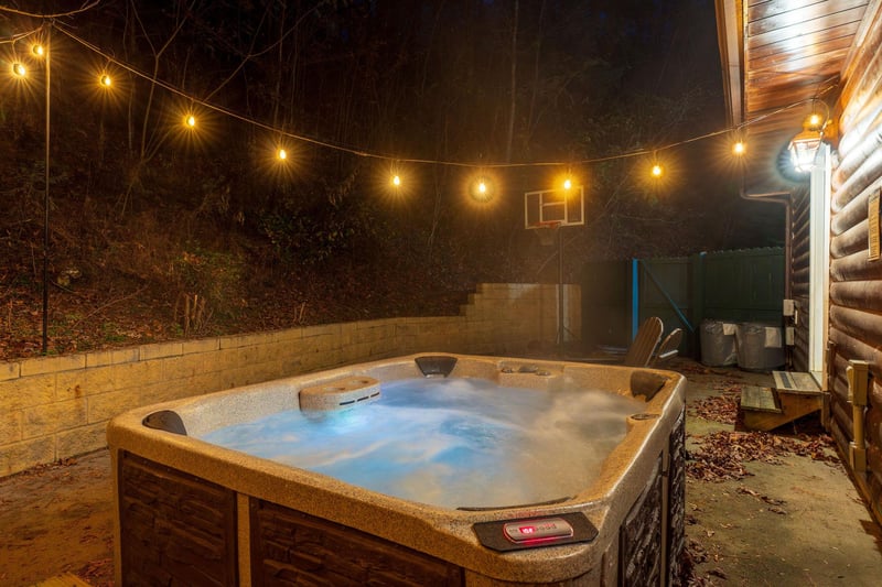 Soak under the stars in your private hot tub, surrounded by warm string lights and the peaceful mountain evening. A perfect spot to unwind after a day of adventure.