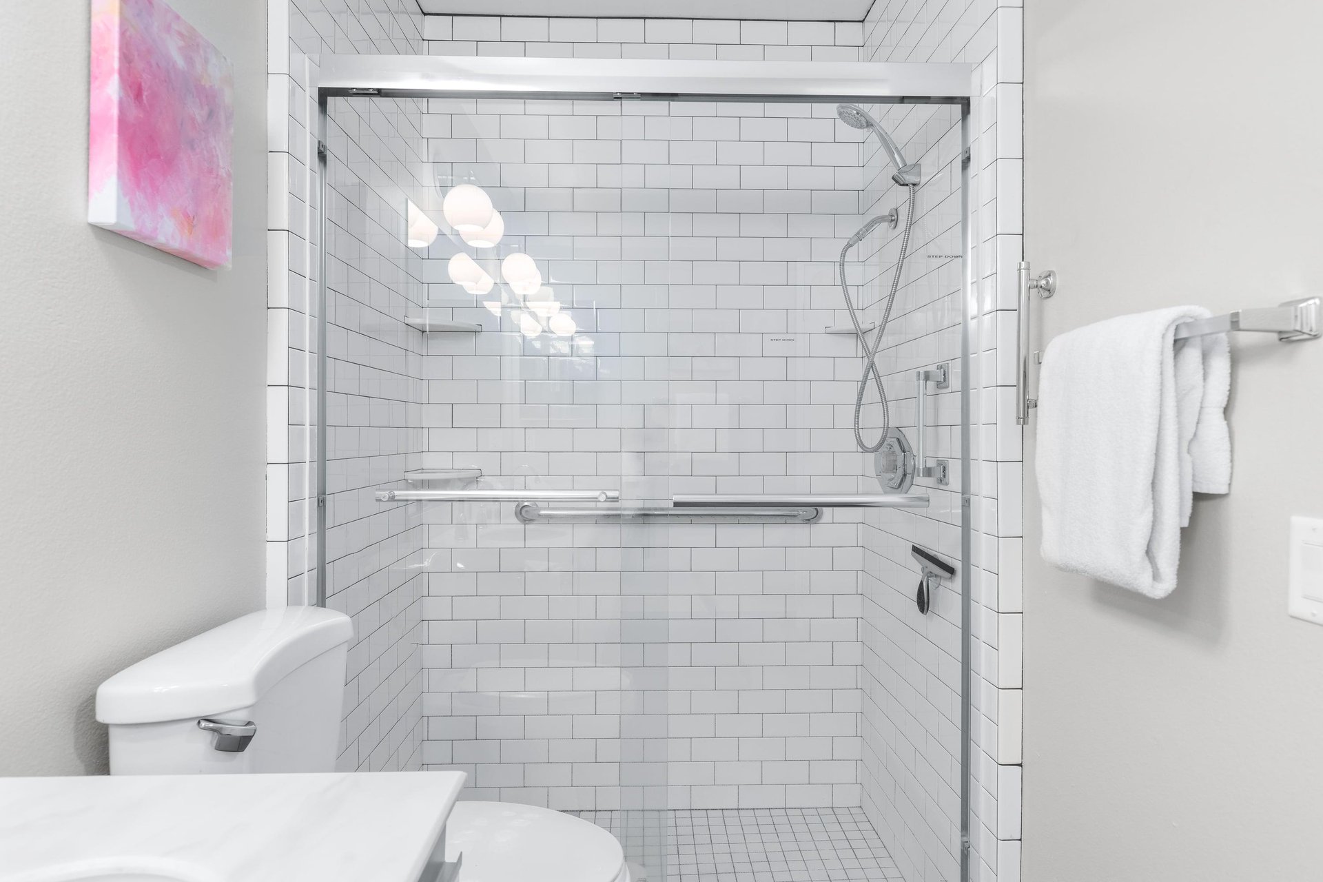 Ensuite bathroom with dual vanity sinks and walkin shower.