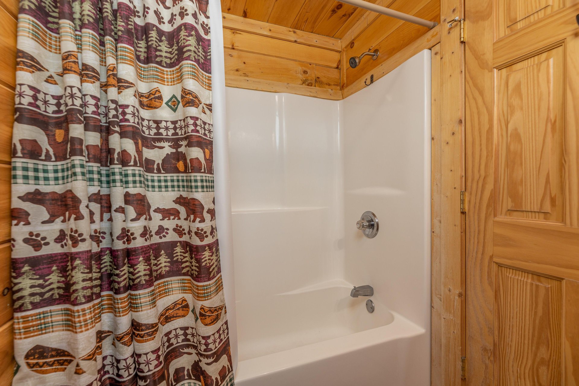 Bathroom with a tub and shower at Bears Dont Bluff, a 3 bedroom cabin rental located in Pigeon Forge