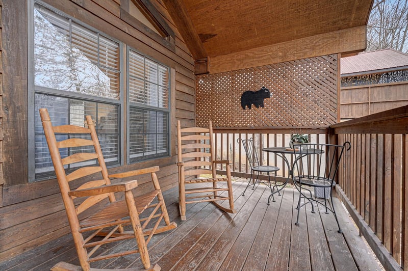 Unwind on your private covered deck with rustic rocking chairs and charming bistro dining—perfect for morning coffee or evening relaxation.