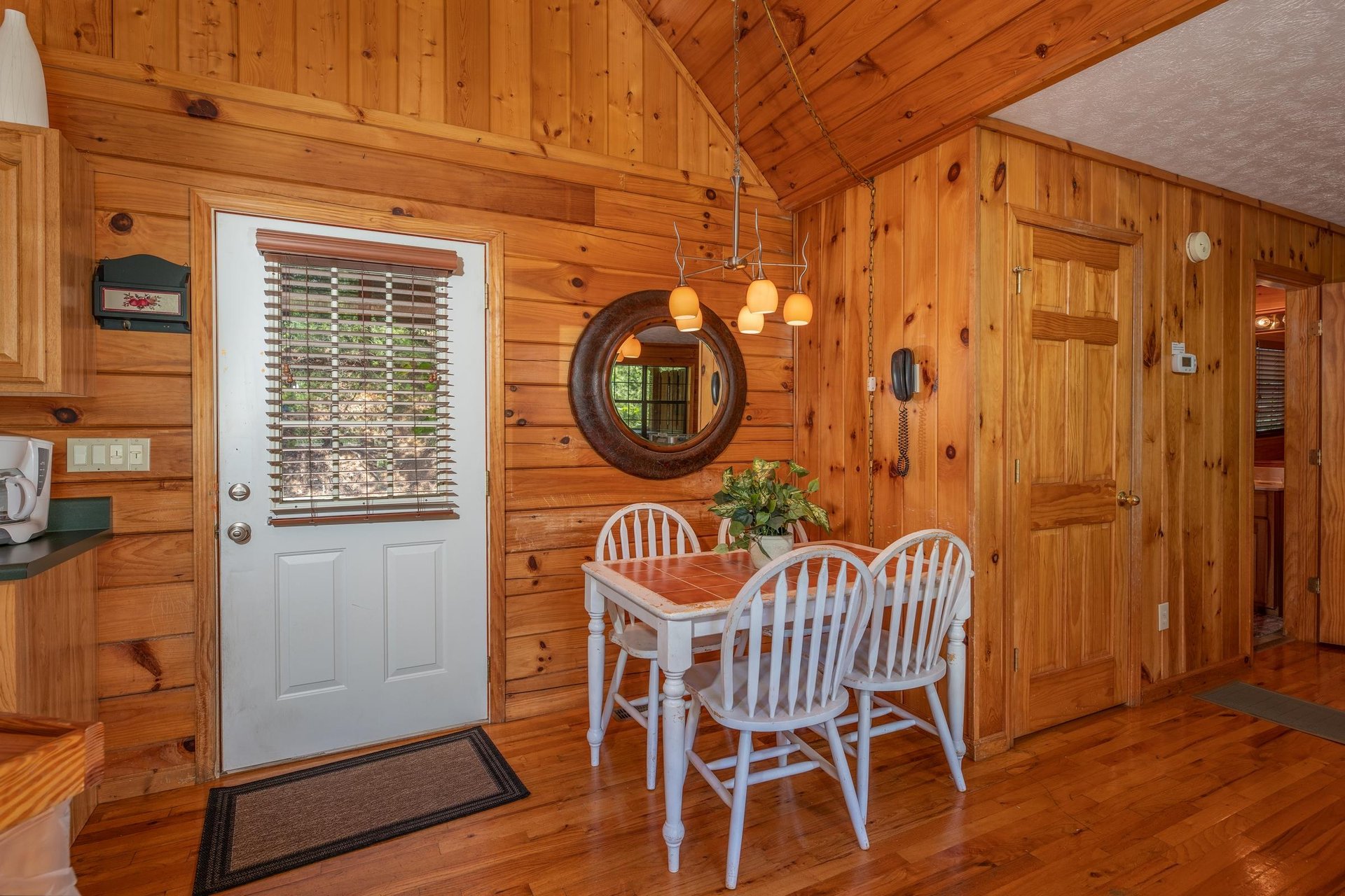 Kitchen table at Hello Dolly, a 1 bedroom cabin rental located in Pigeon Forge