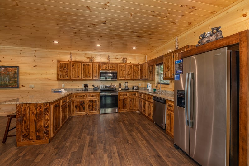 Full kitchen with natural wood cabinets