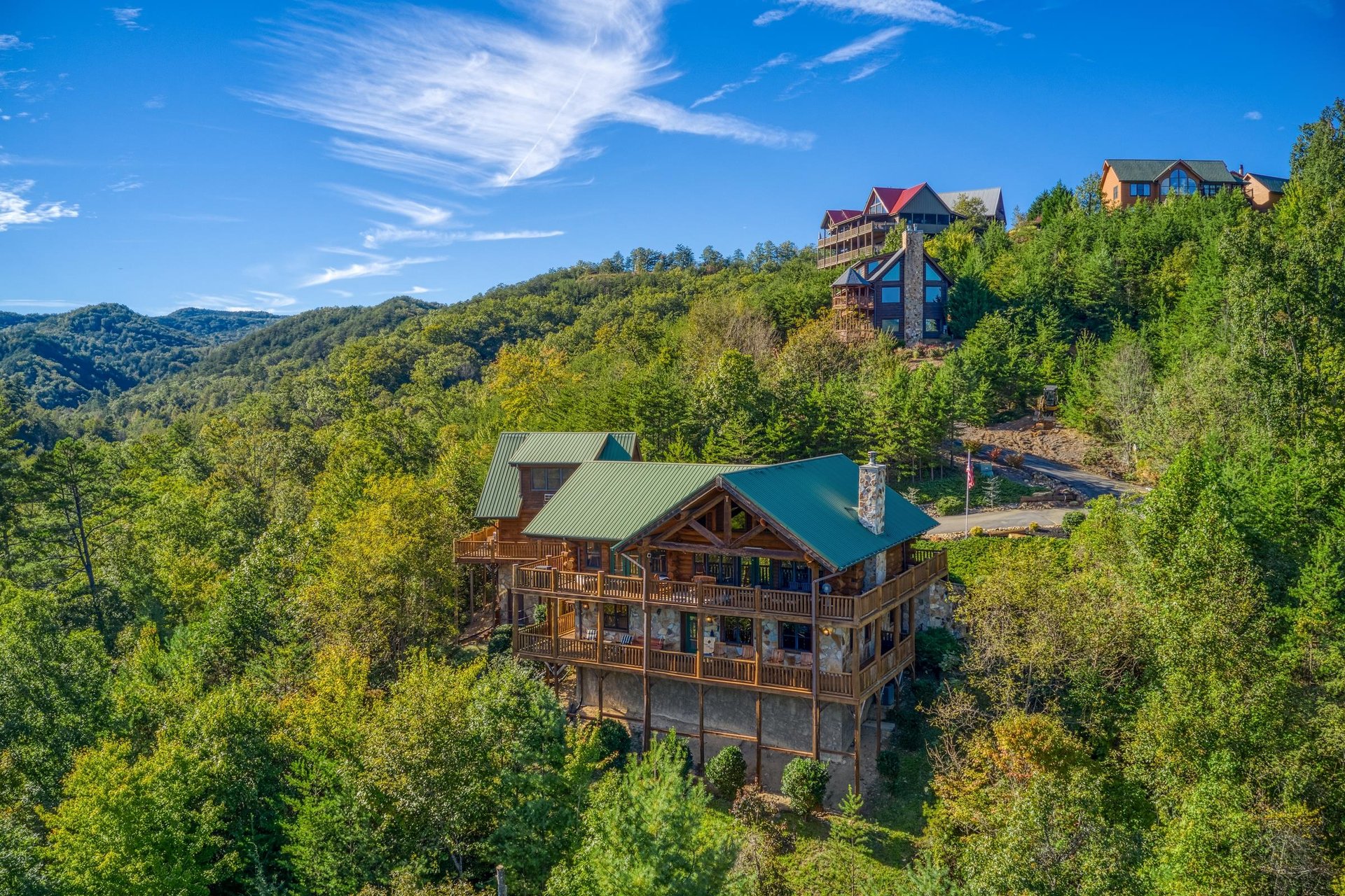 Looking at a cabin nestled in the hillside called Great View Lodge, a 5bedroom cabin rental located in Pigeon Forge