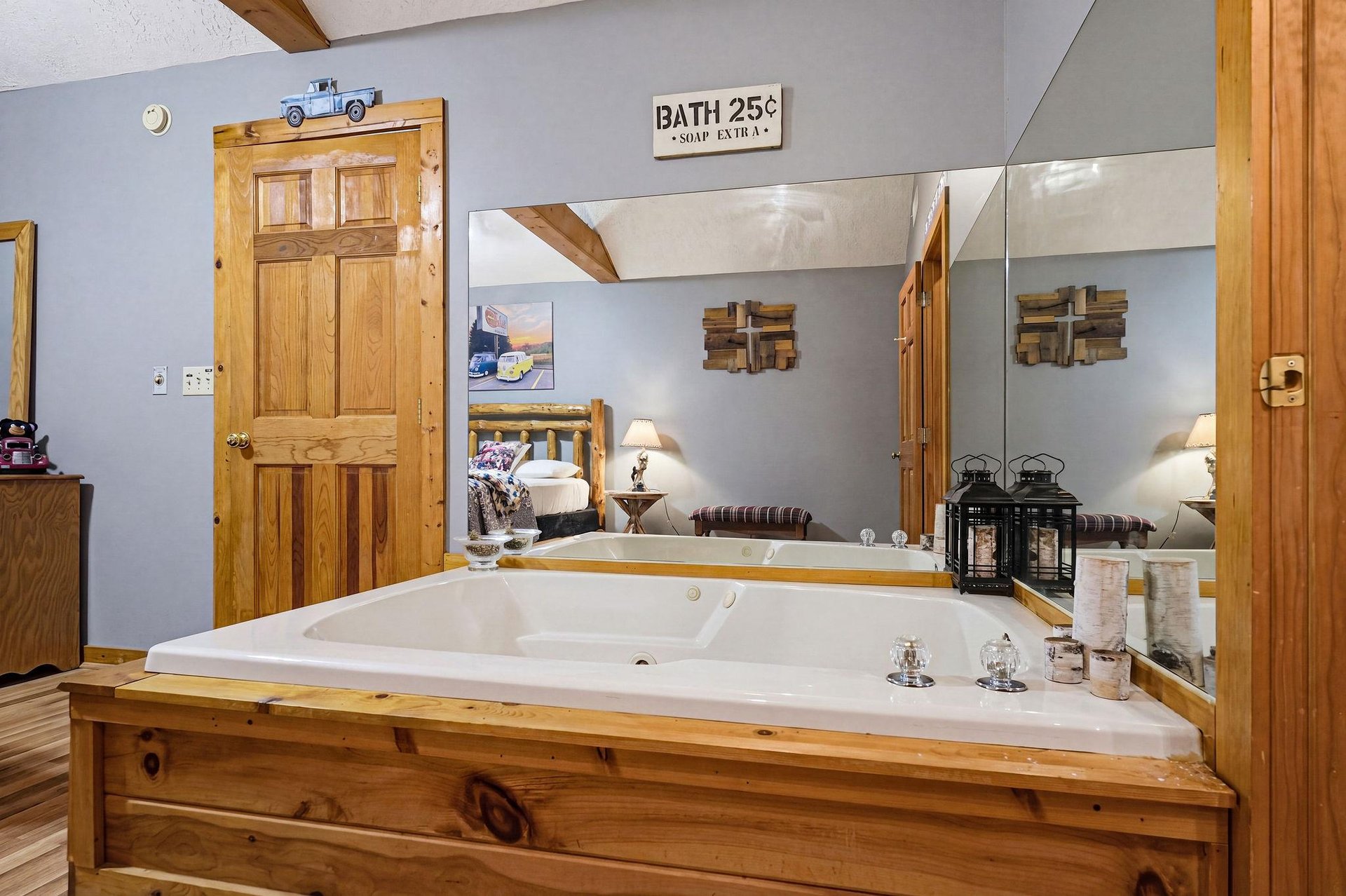 Slip into your spacious jetted tub and let the warm water ease away the day, surrounded by rustic pine and cozy touches that make this retreat feel like home.