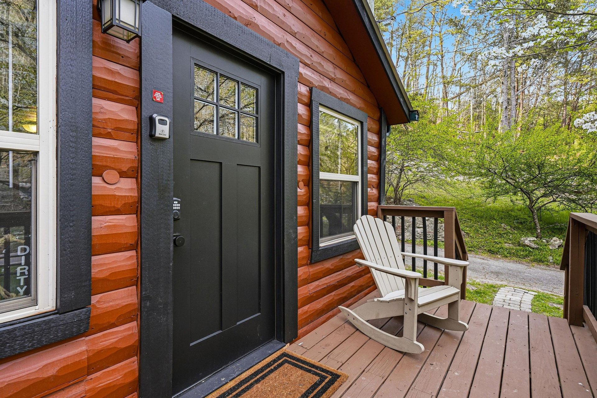 Step onto your private wooden deck and settle into the rocking chair, where springs fresh greenery surrounds your cozy log cabin retreat.