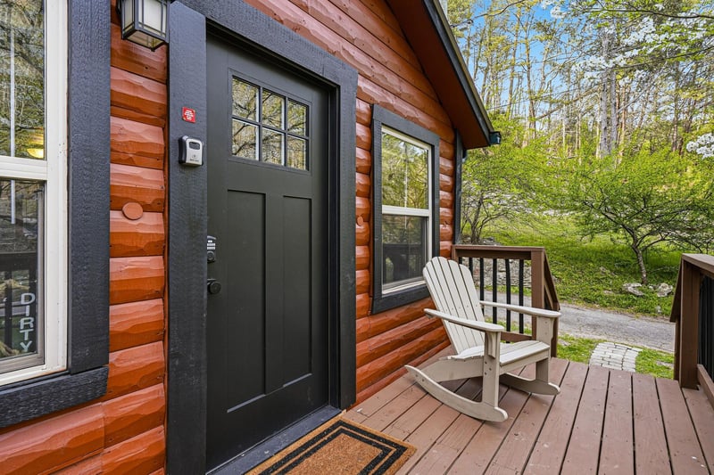 Step onto your private wooden deck and settle into the rocking chair, where springs fresh greenery surrounds your cozy log cabin retreat.