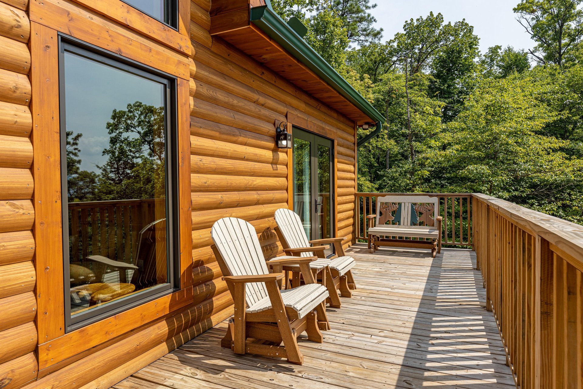 Adirondack chairs and bench at Js Hideaway, a 4 bedroom cabin rental located in Pigeon Forge