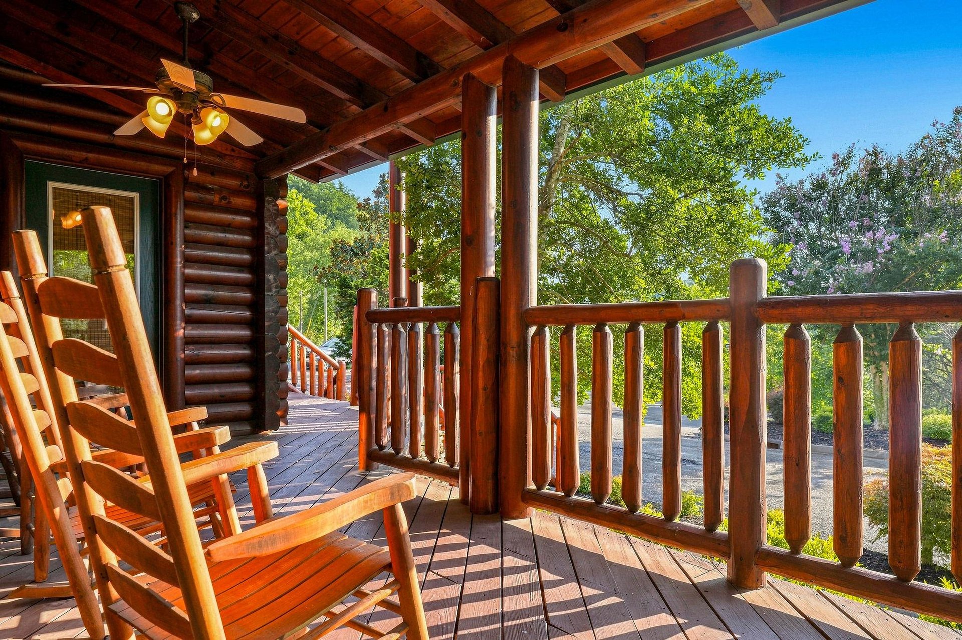 Sink into the rocking chair on your private covered porch and take in the lush treetops and peaceful natural surroundings—perfect for morning coffee or quiet evenings under the open sky.