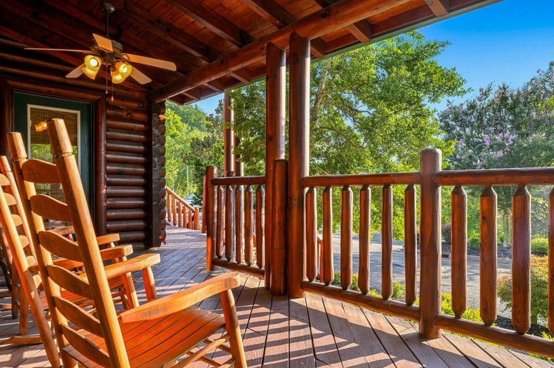 Sink into the rocking chair on your private covered porch and take in the lush treetops and peaceful natural surroundings—perfect for morning coffee or quiet evenings under the open sky.