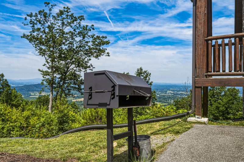 Enjoy mountain views and fresh air while grilling outdoors on the expansive grounds, surrounded by rolling hills and bright summer skies.