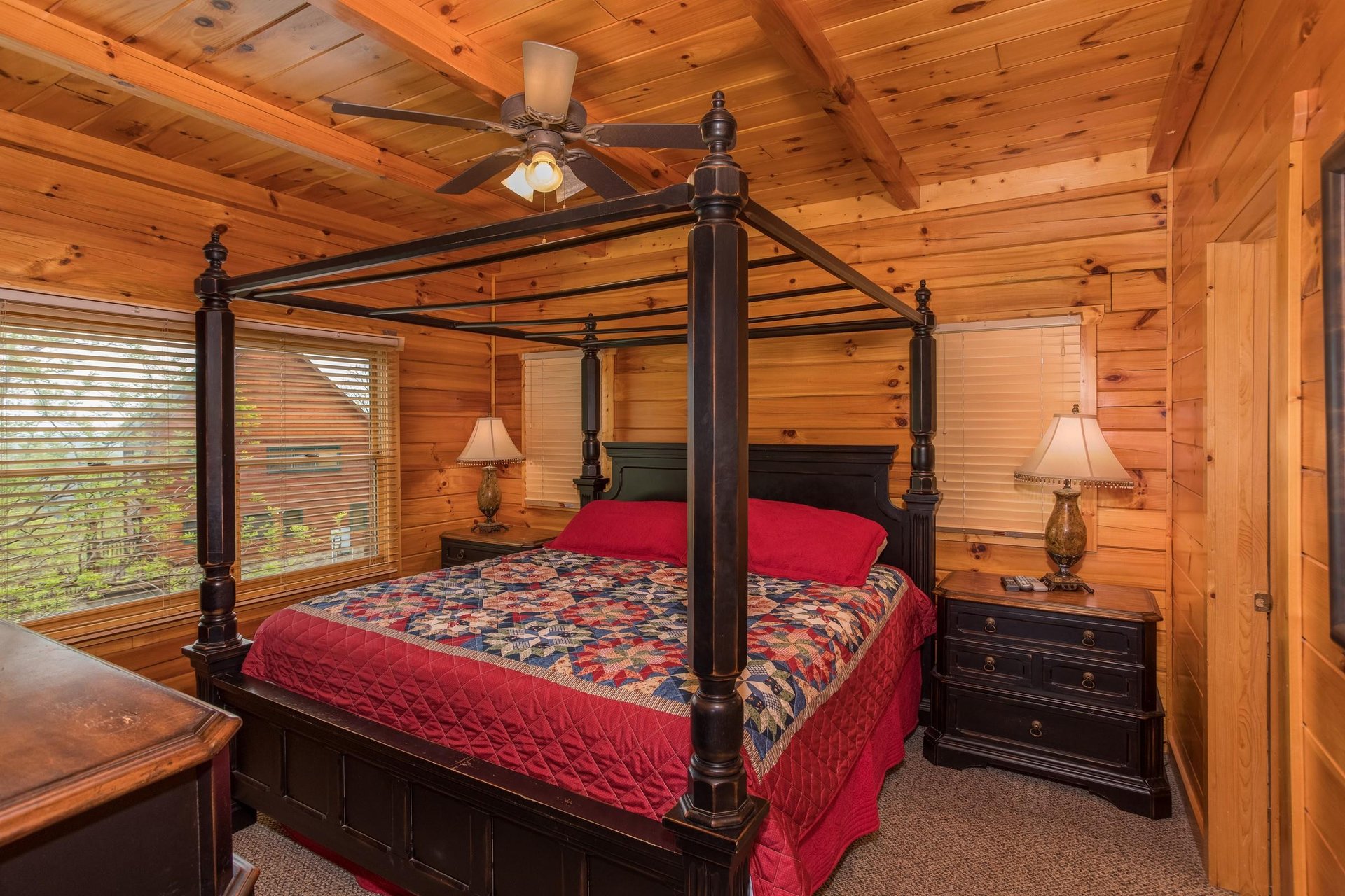 King sized canopy bed at Howlin in the Smokies, a 2 bedroom cabin rental located in Pigeon Forge