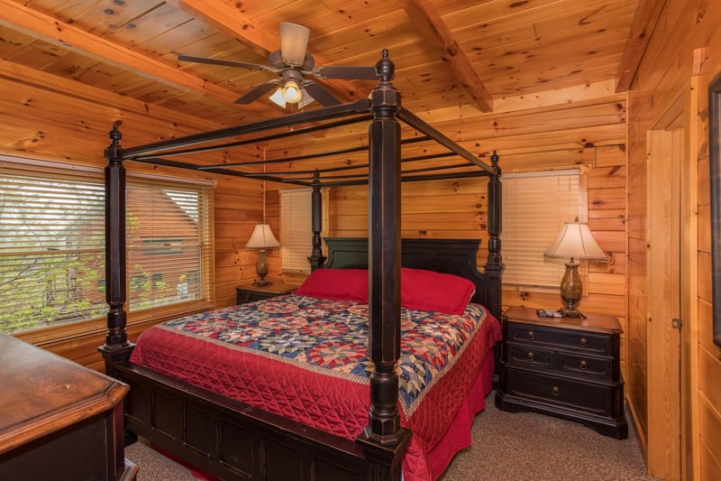 King sized canopy bed at Howlin in the Smokies, a 2 bedroom cabin rental located in Pigeon Forge