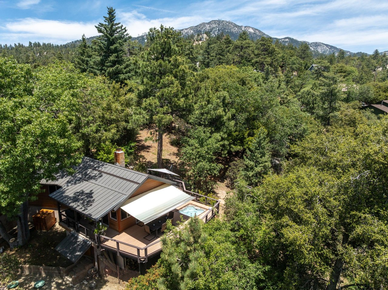 Nestled in the trees, mountain views.