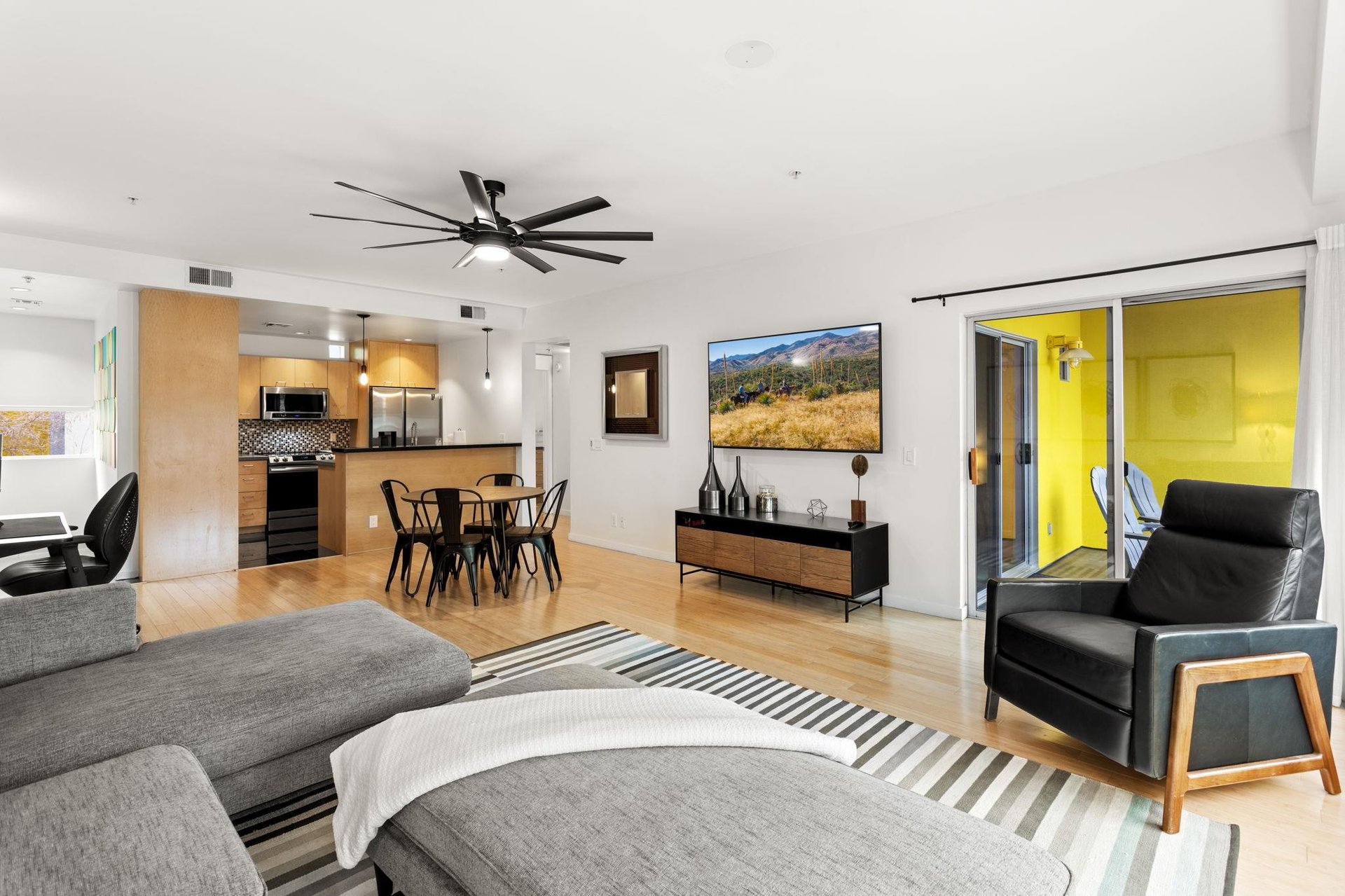 Spacious living room with ample seating and openfloor concept.
