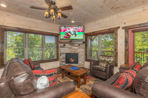 Living room with stone fireplace