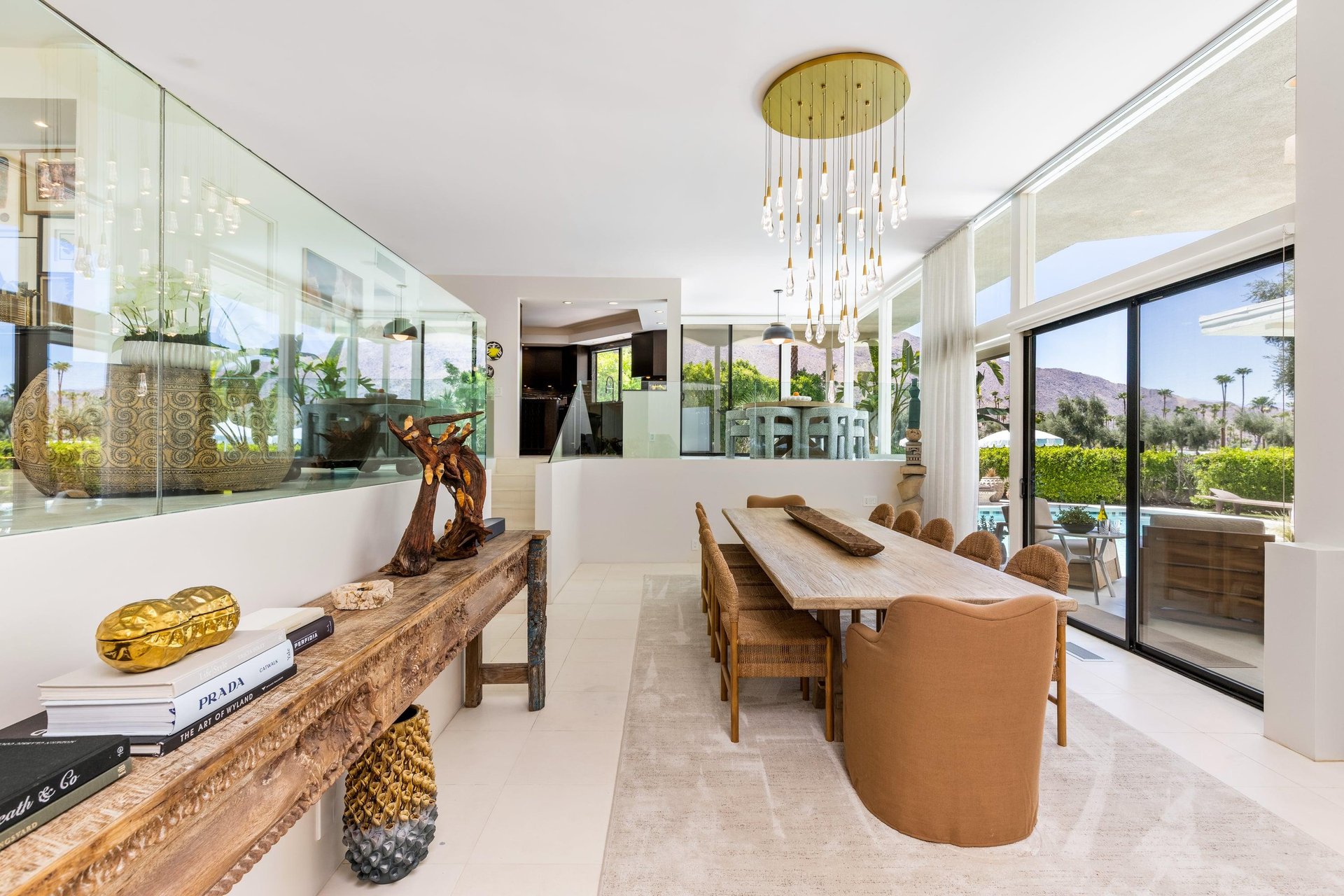 Dining room has a table and chairs for up to 12 guests. Pool views can be seen from the dining space.