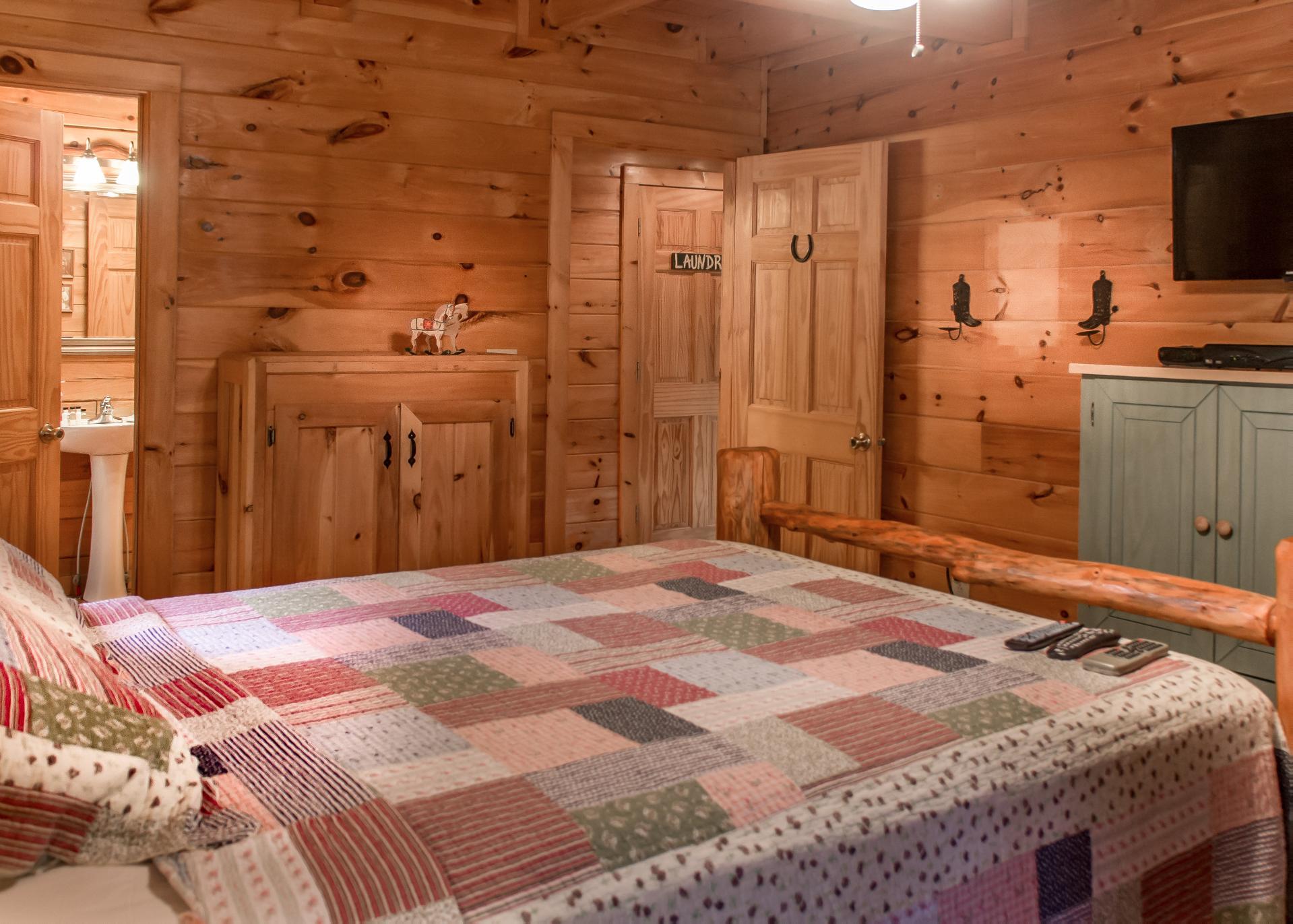 On the first floor youll find a queen bedroom with an attached full bathroom that features a shower stall and pedestal sink.