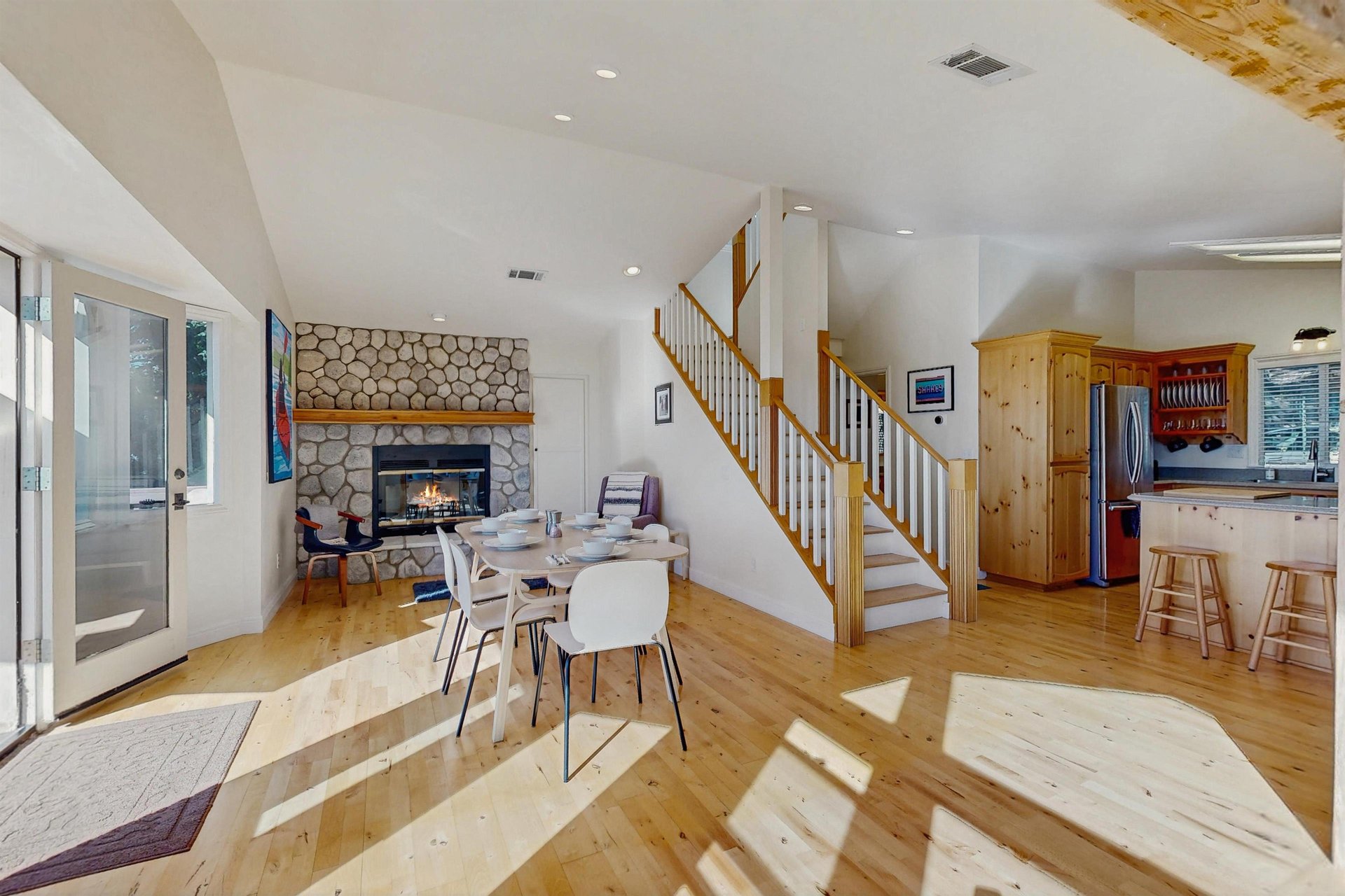 Dining area with table, chairs for 6 guests, and 1 of 3 fireplaces.