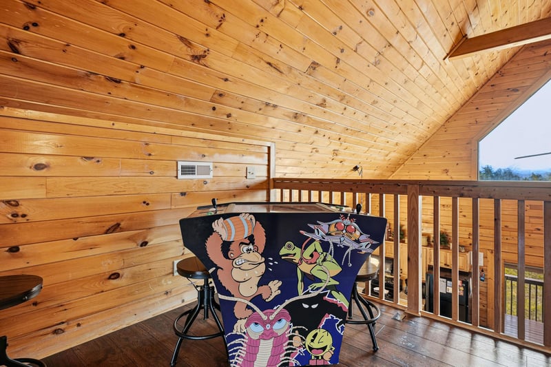 Unwind on your private covered balcony with cozy seating, where warm wood surroundings create the perfect retreat for morning coffee or evening relaxation.