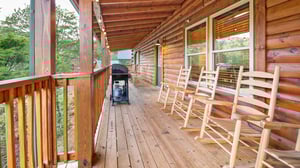 deck with grill and seating