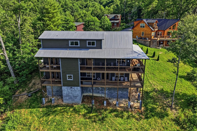 Charming mountain retreat nestled among lush trees with wraparound decks perfect for morning coffee and stargazing. Natural privacy in a wooded hillside setting close to neighboring cabins.